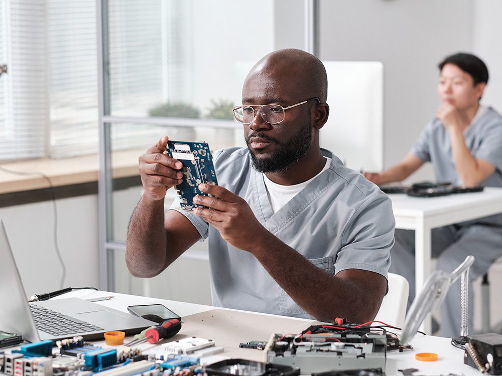 workforce man looking at semiconductor chip